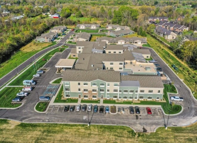 default A drone shot of Traditions of Columbus showing the parking lot and garden homes.
